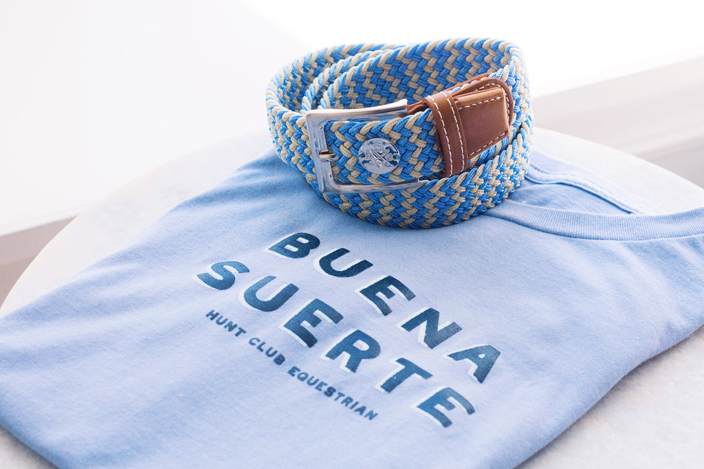 A carolina blue Hunt Club tee with the words Buena Suerte. 