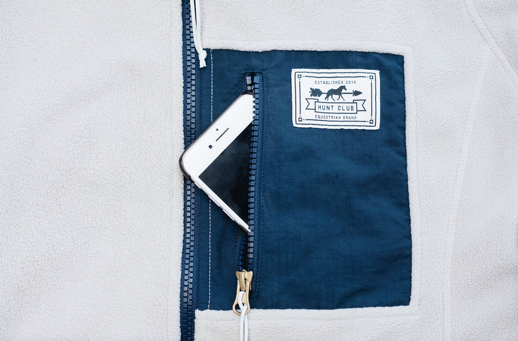 Close-up of the phone pocket on Hunt Club's oatmeal and navy fleece jacket. 