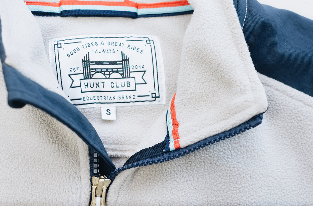 Close-up detail of Hunt Club's oatmeal colored fleece jacket. 