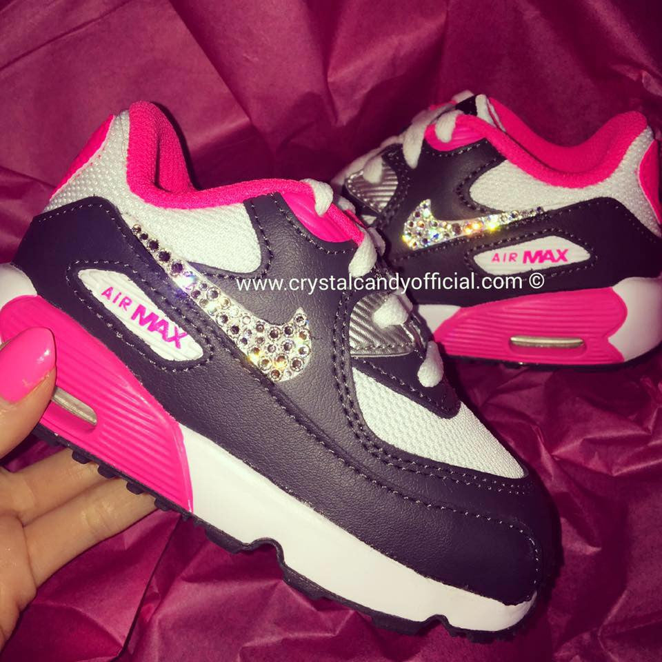 black nike shoes with pink tick