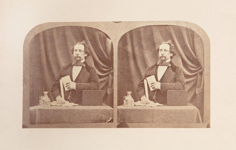 Photograph of Dickens at reading desk