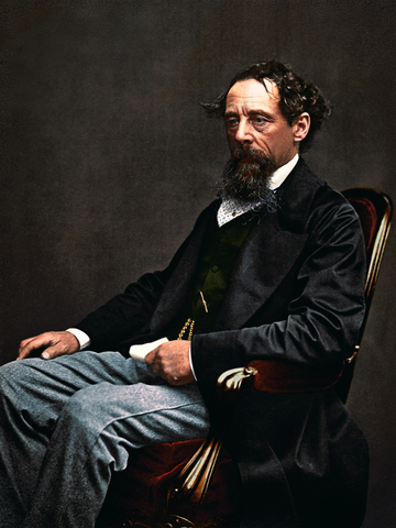 Charles Dickens, seated. 