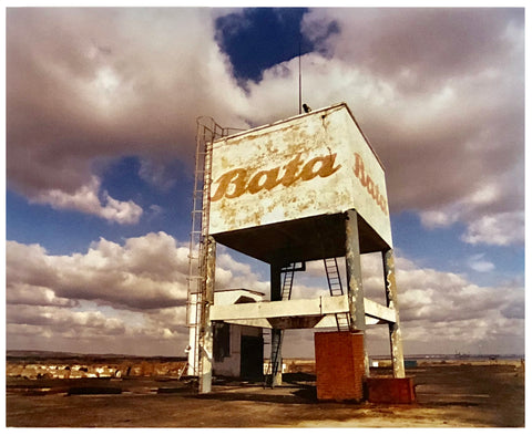 Bata Water Tower in Thurrock with moody clouds in the sky photograph.