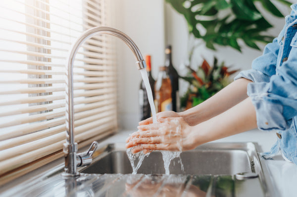 A woman washing her hands