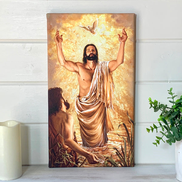 Baptism Of Jesus Canvas Wall Art. Jesus looking at a dove after being baptized staged on a wall.