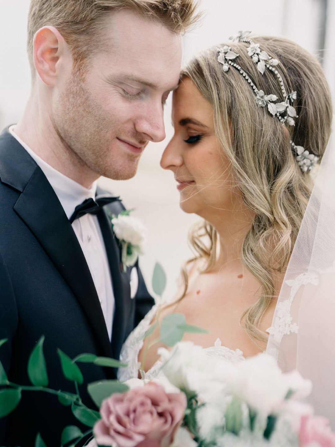 Bride and groom touch foreheads