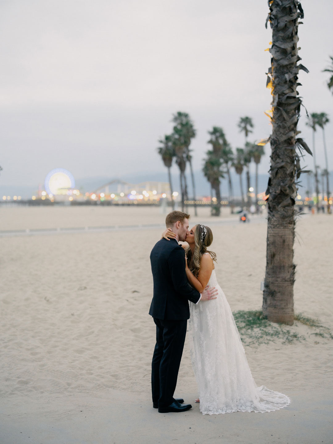 Bride and Groom Kiss on Beach