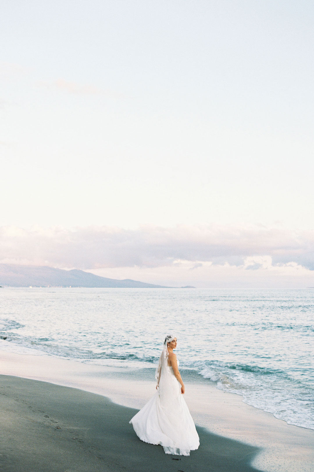 Bride on Beach in Arabella by Claire Pettibone 