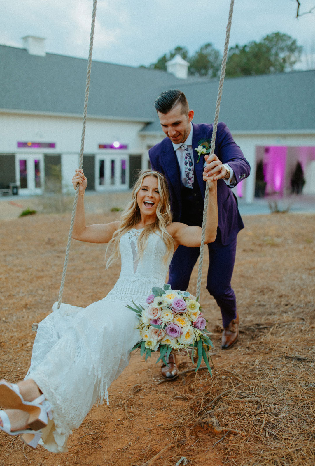 Bride in swing Groom pushing 