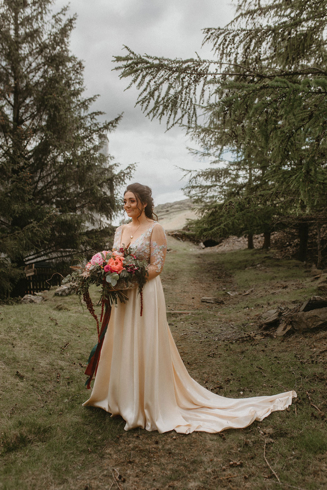 Bride wearing Santorini Wedding Dress by Claire Pettibone