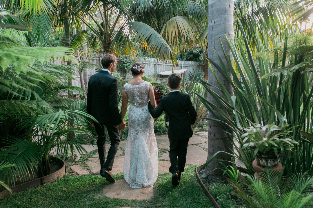 Bride and Husband walk with son