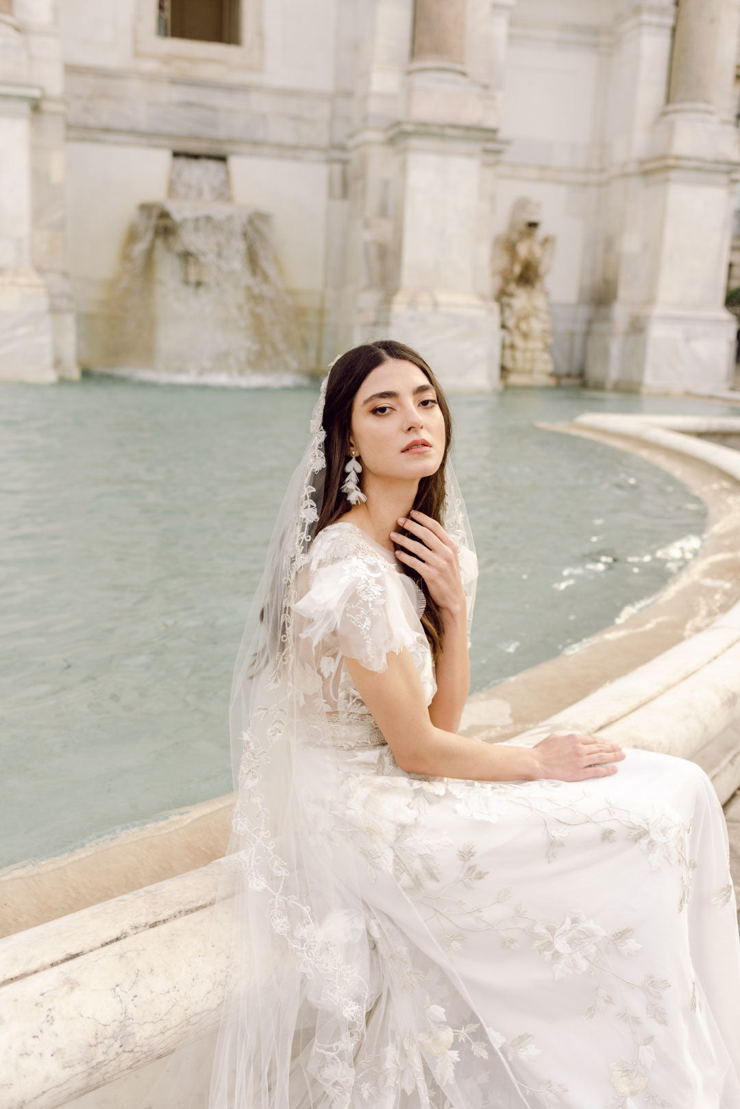 Bride seated in Chloris Wedding Dress