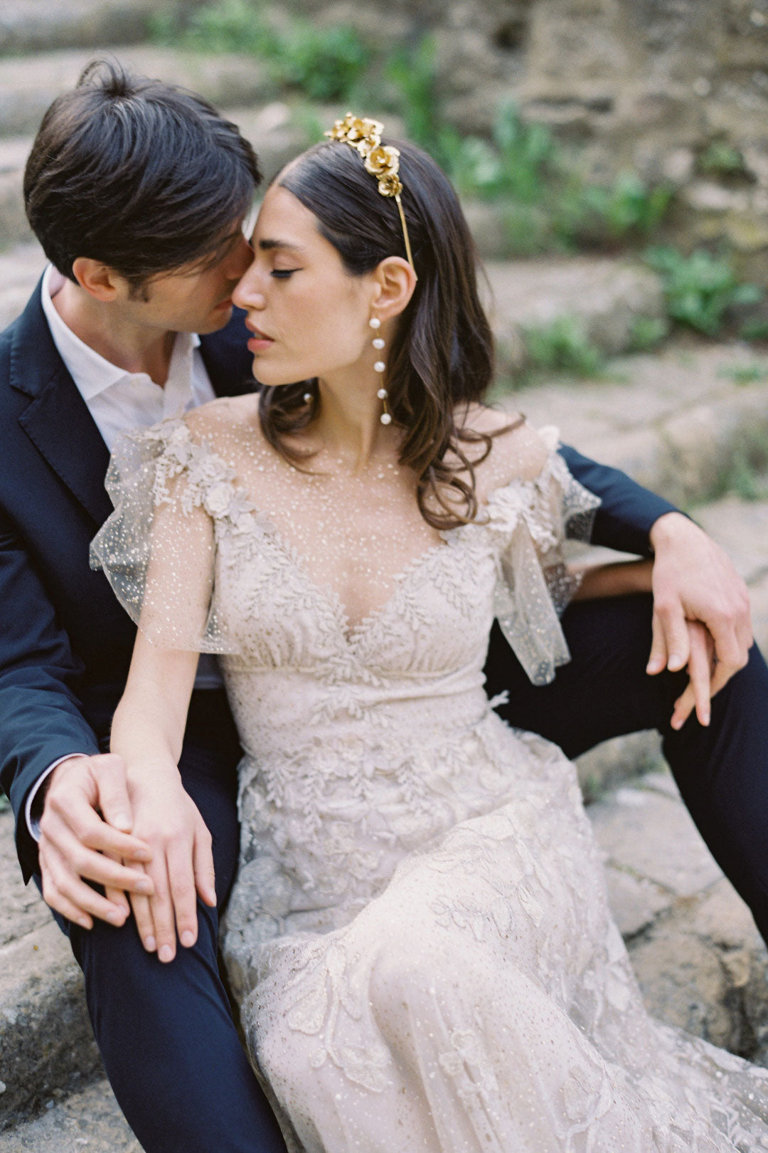 Bride and Groom Seated for Wedding photo on Villa Stairs