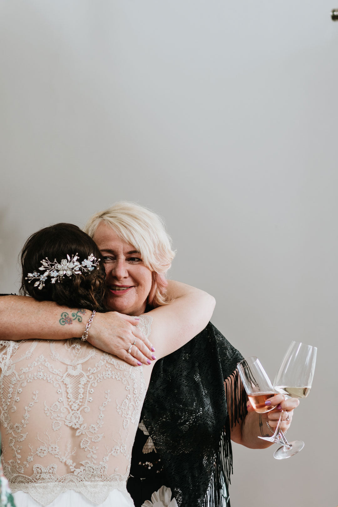 Bride hugging friend