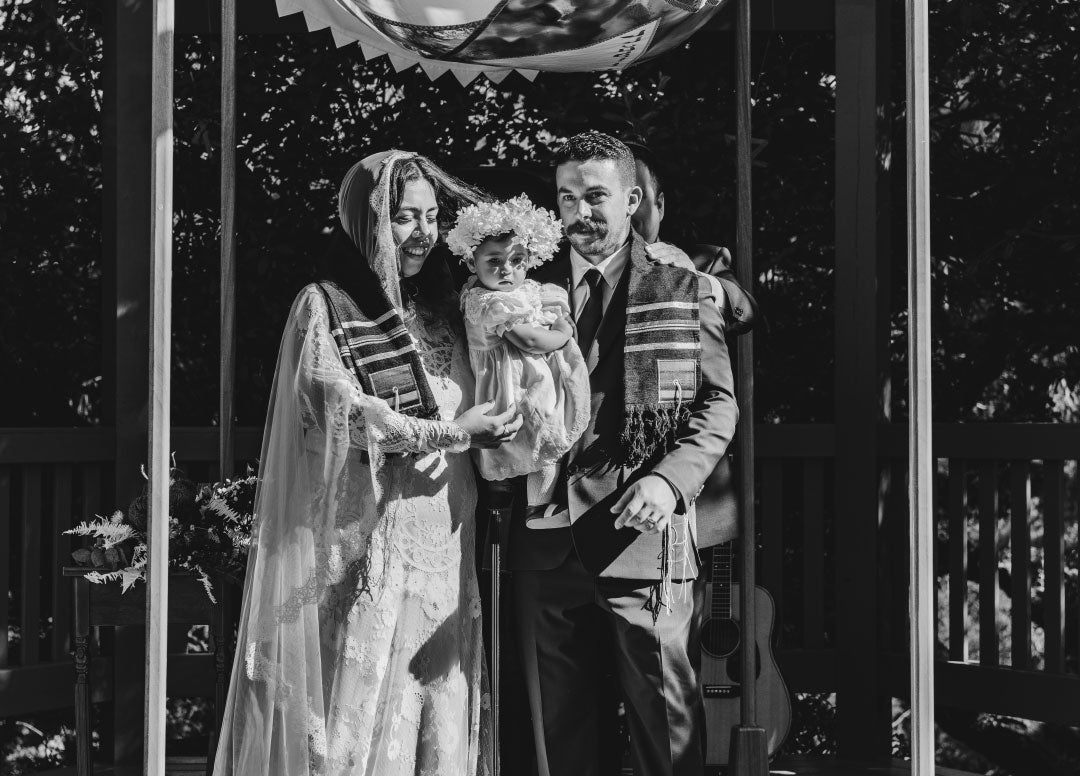 Bride and Groom after wedding vows wearing the tallit