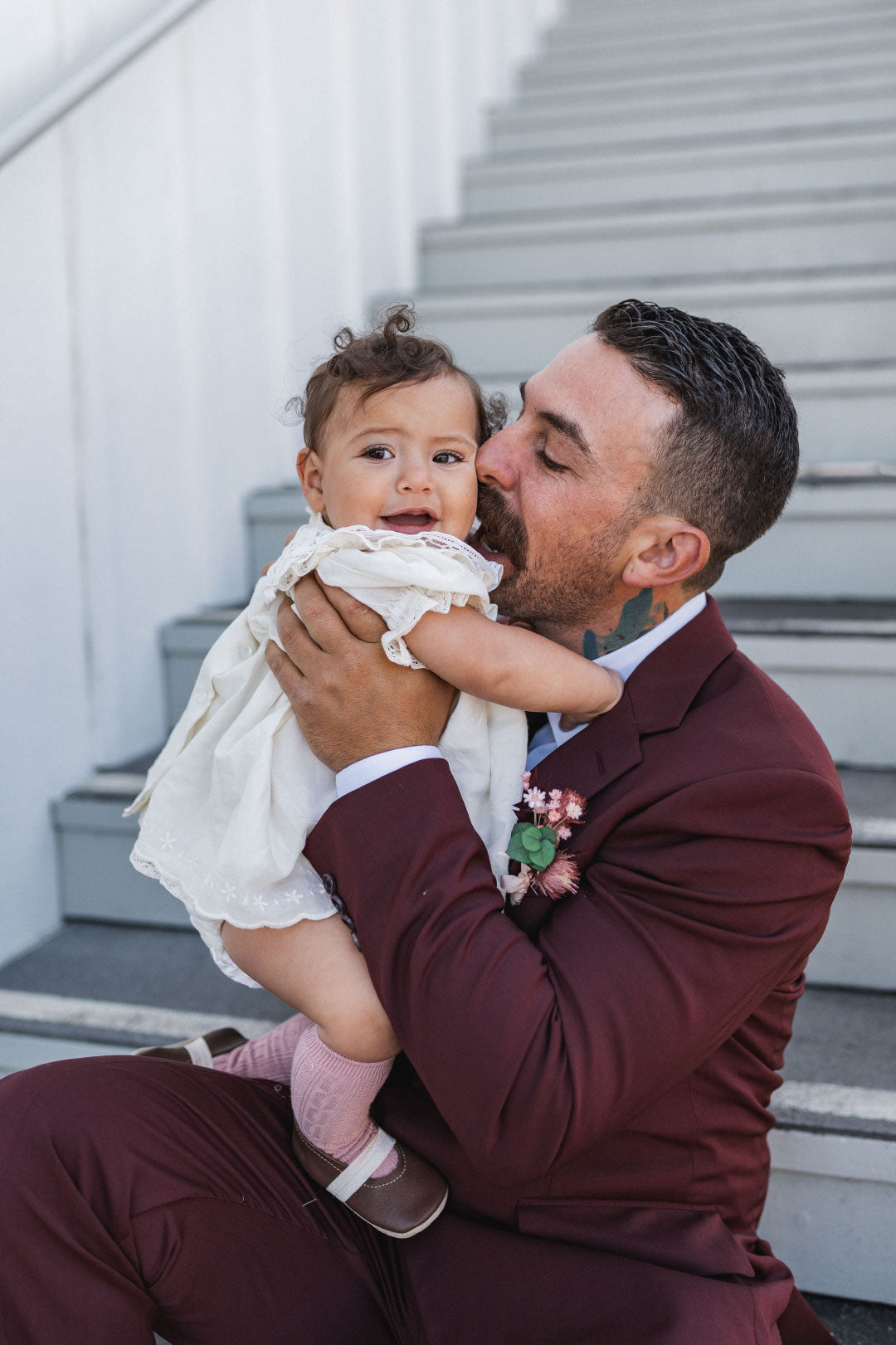 Groom Dad kissing baby