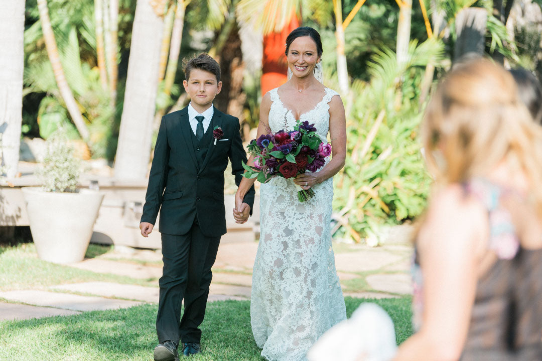 Bride walking aisle with son