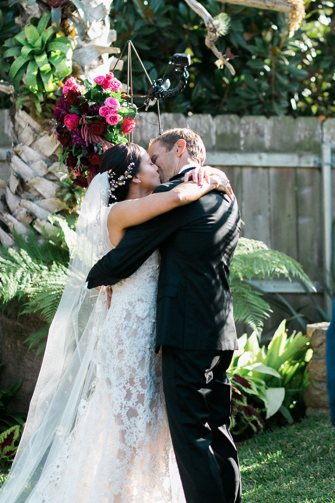 Bride and groom kiss after vows