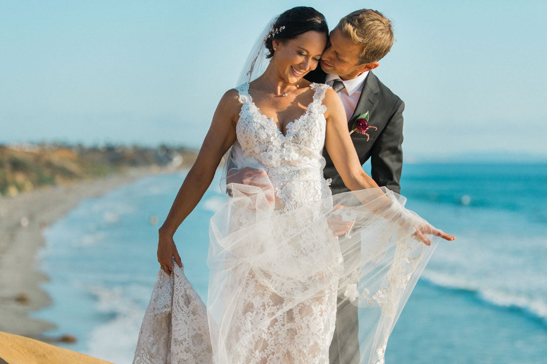 Bride and goom on beach bluff