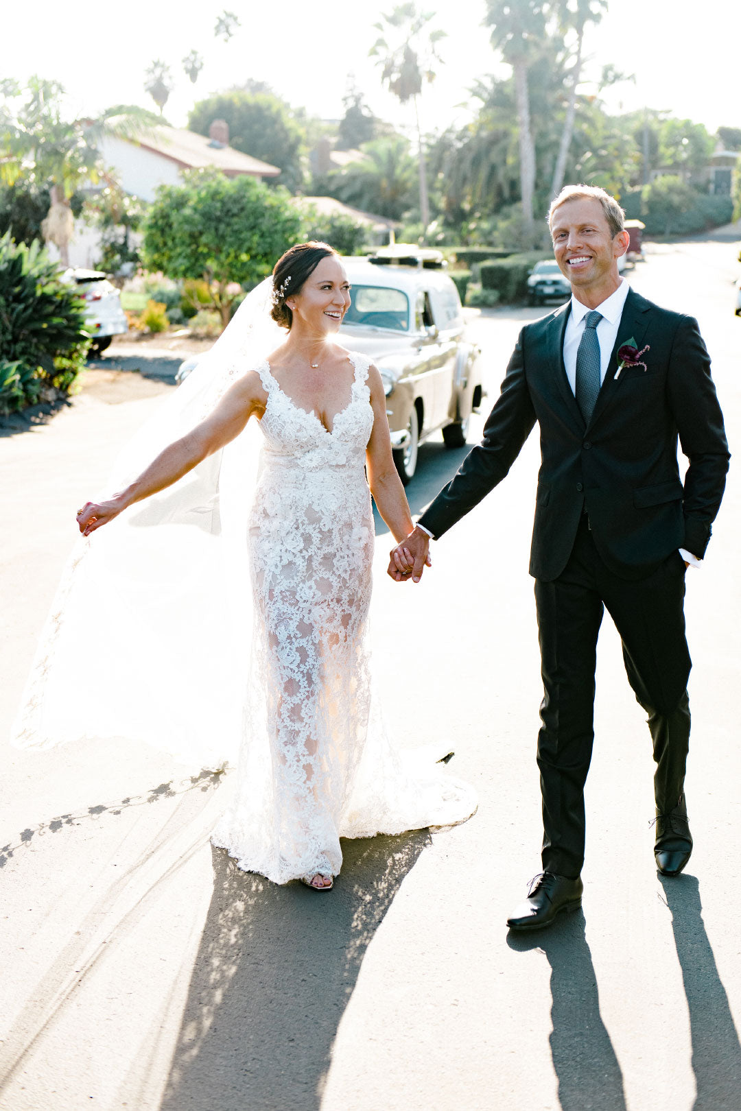 Bride and groom before wedding bride in lace wedding dress 