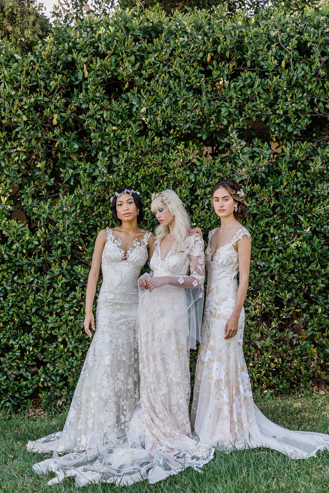 Models wear Claire Pettibone Wedding Dress Designs Les Fleurs Collection