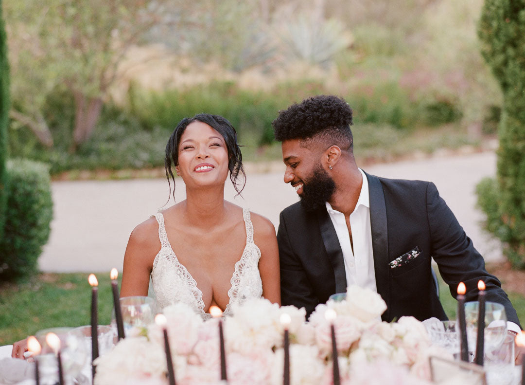 Bride and Groom at table with candles