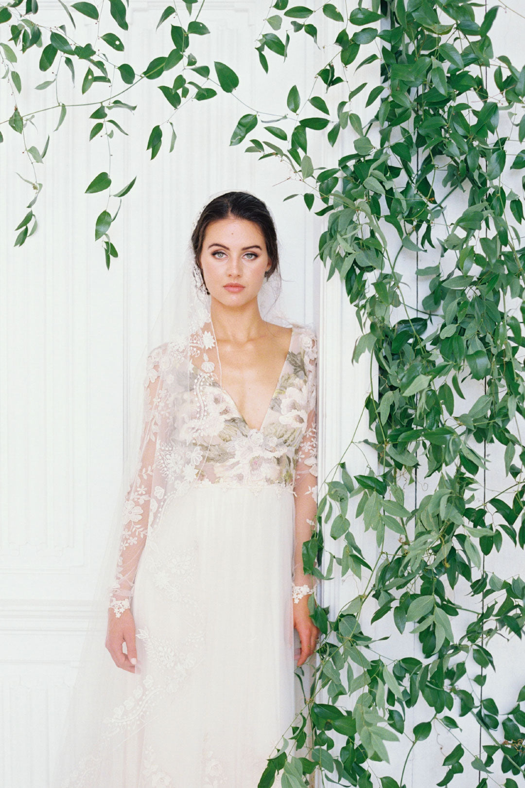 Bride near floral arch