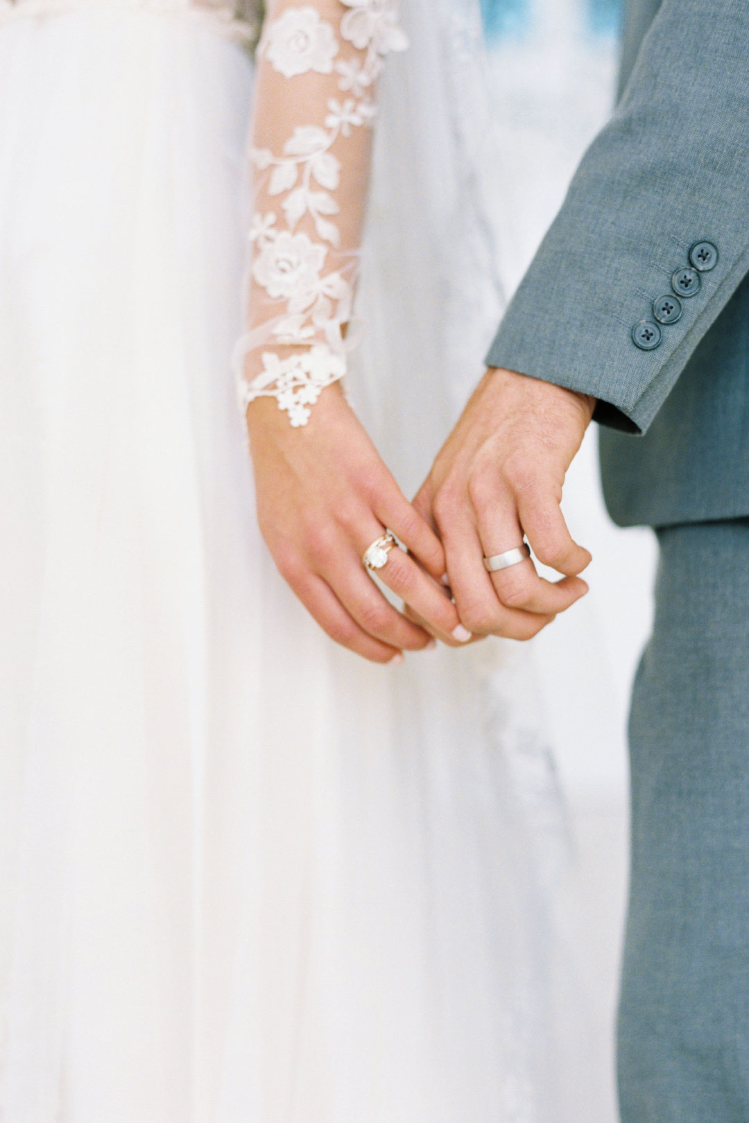 Hands holding wedding rings 