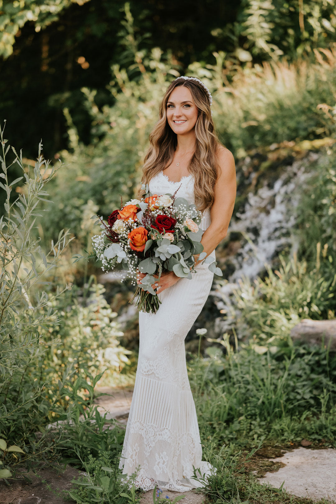 Bride holding wedding floral arrange in Bridal Separates