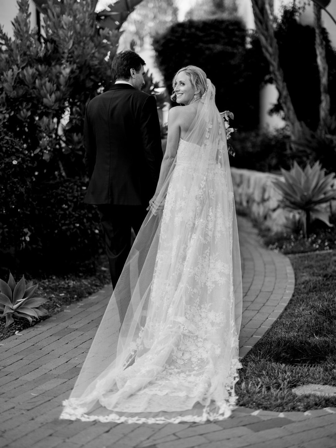 Bride in wedding dress by Claire Pettibone