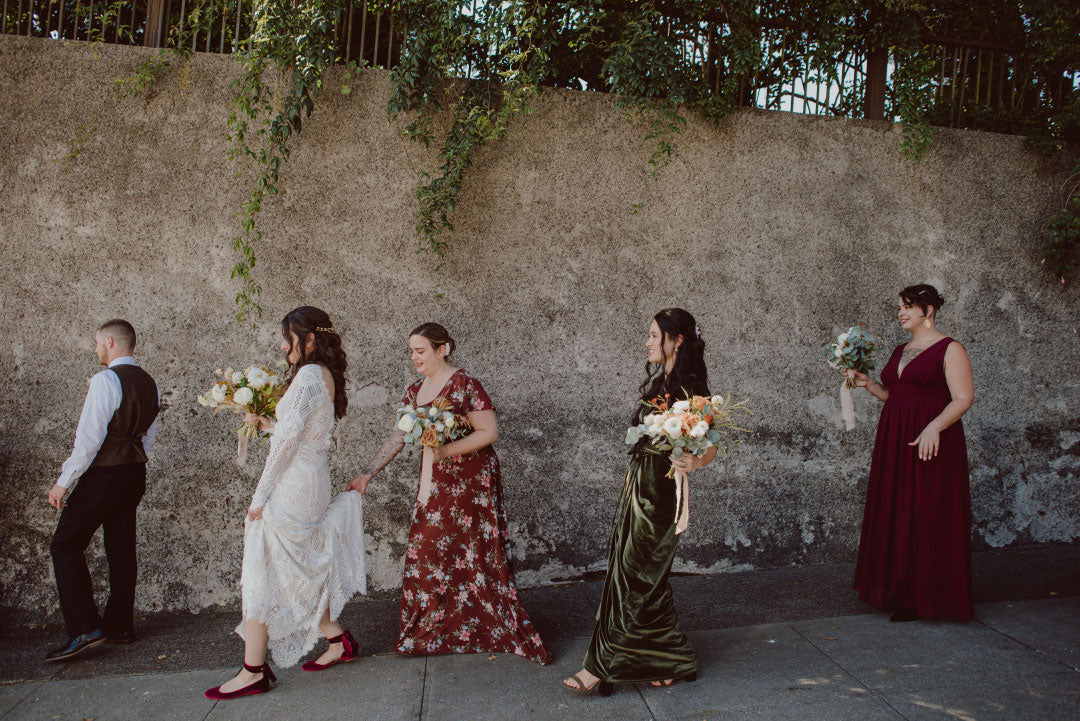 Bride and bridemaids walking after ceremony