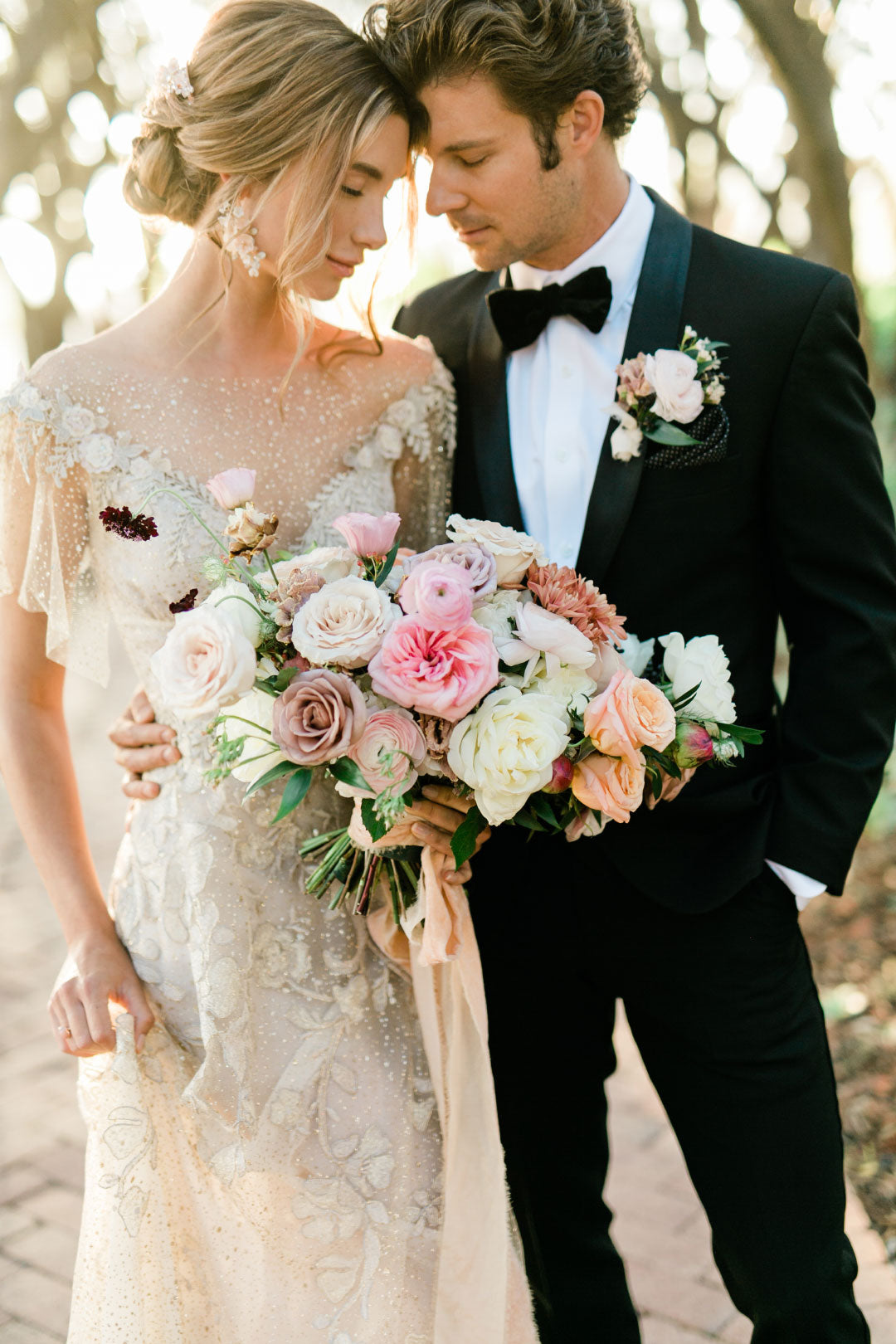 Bride holding wedding bouquet and Groom 