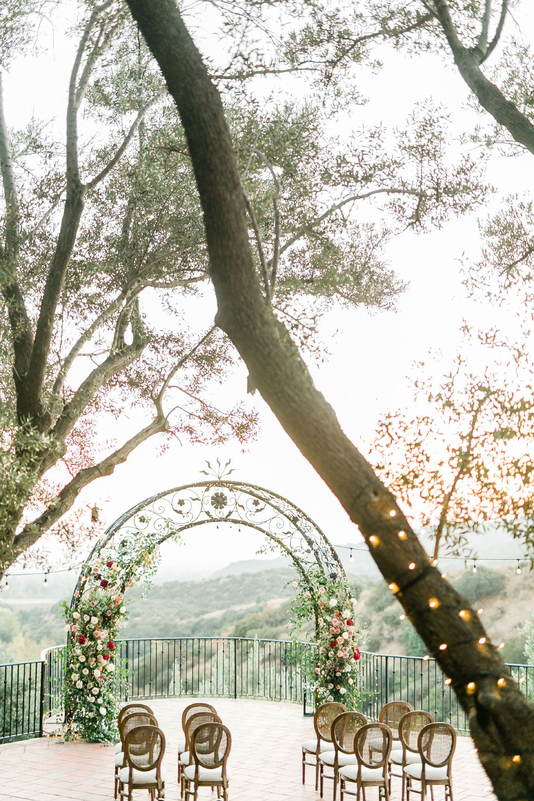 Wedding Ceremony Venue setting with arch and chairs