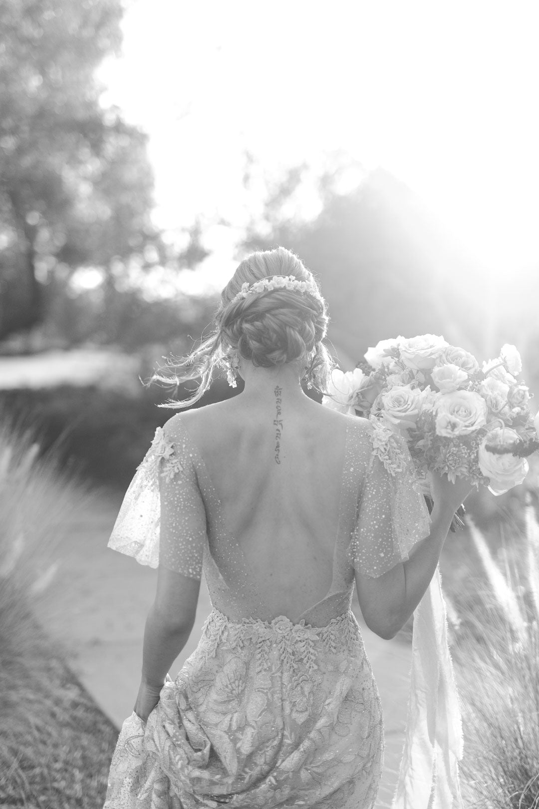 Black and white picture of bride with bouquet