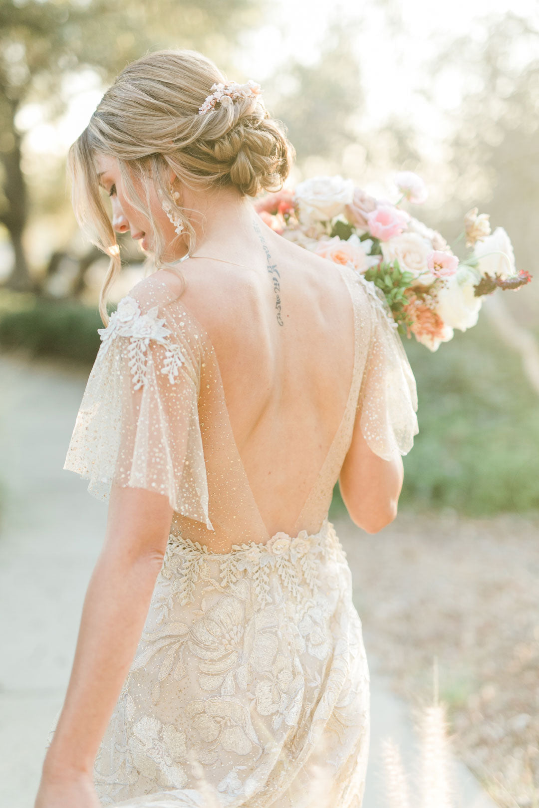 Wedding dress with flutter sleeves by Claire Pettibone