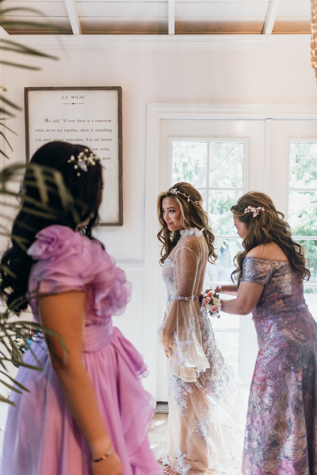 Bride with Bridesmaids dressing before wedding