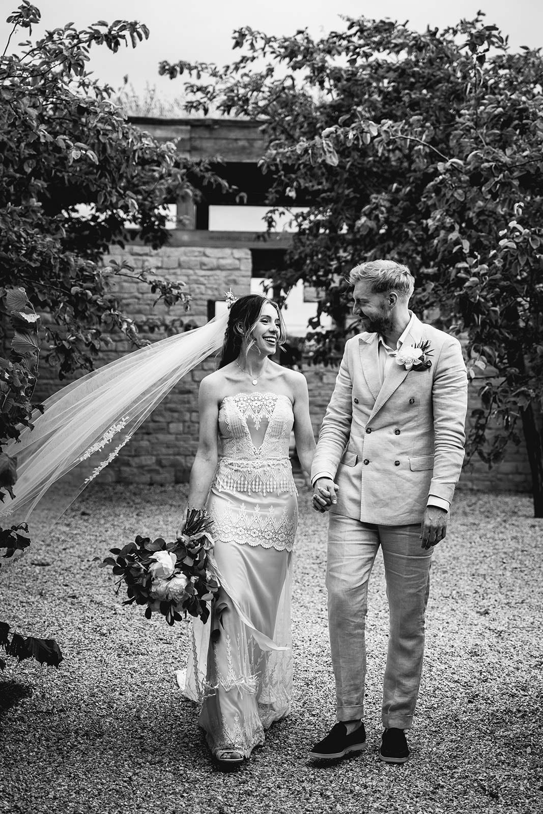 Black and white bride and groom walking together