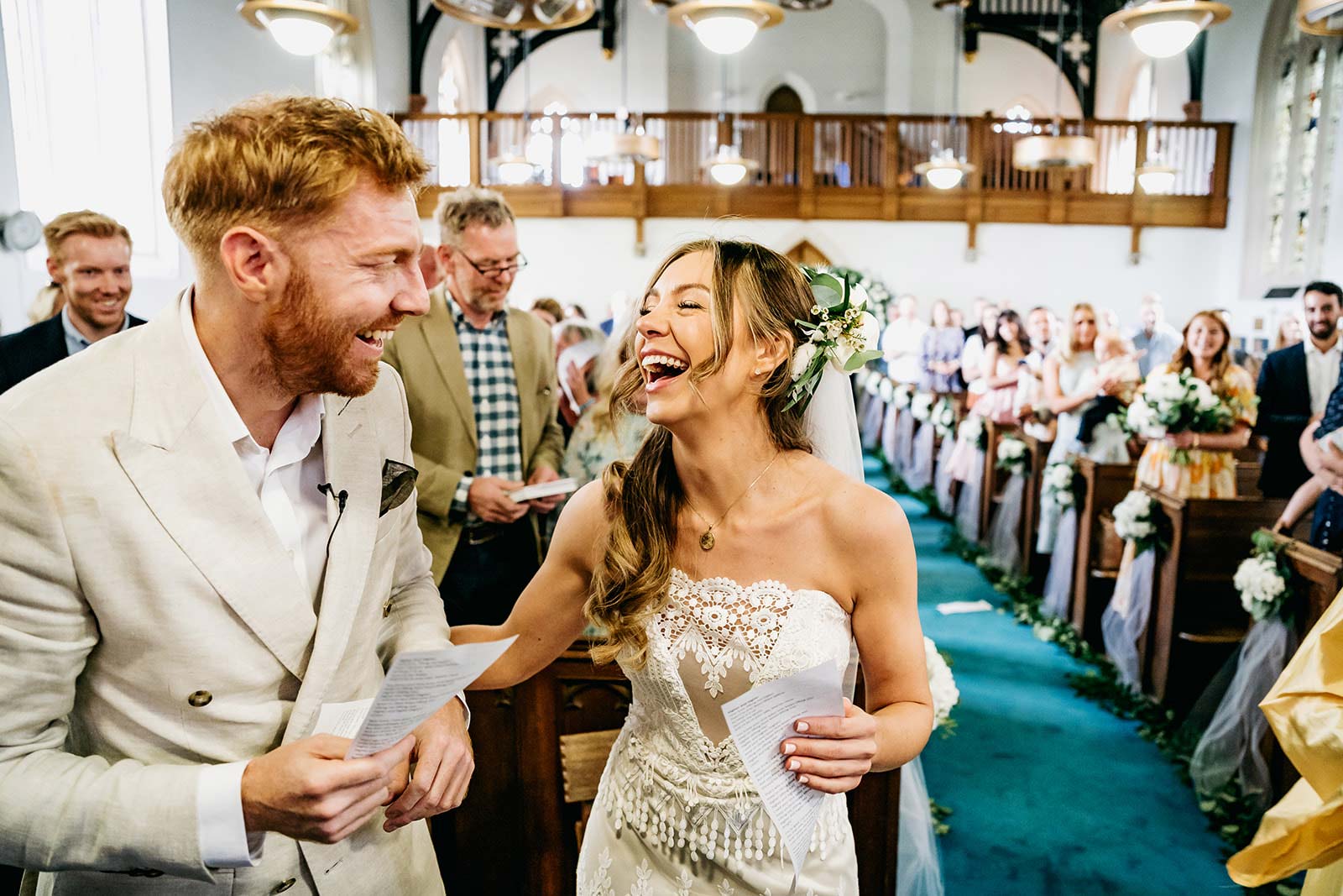 Bride and Groom laughing together after wedding ceremony