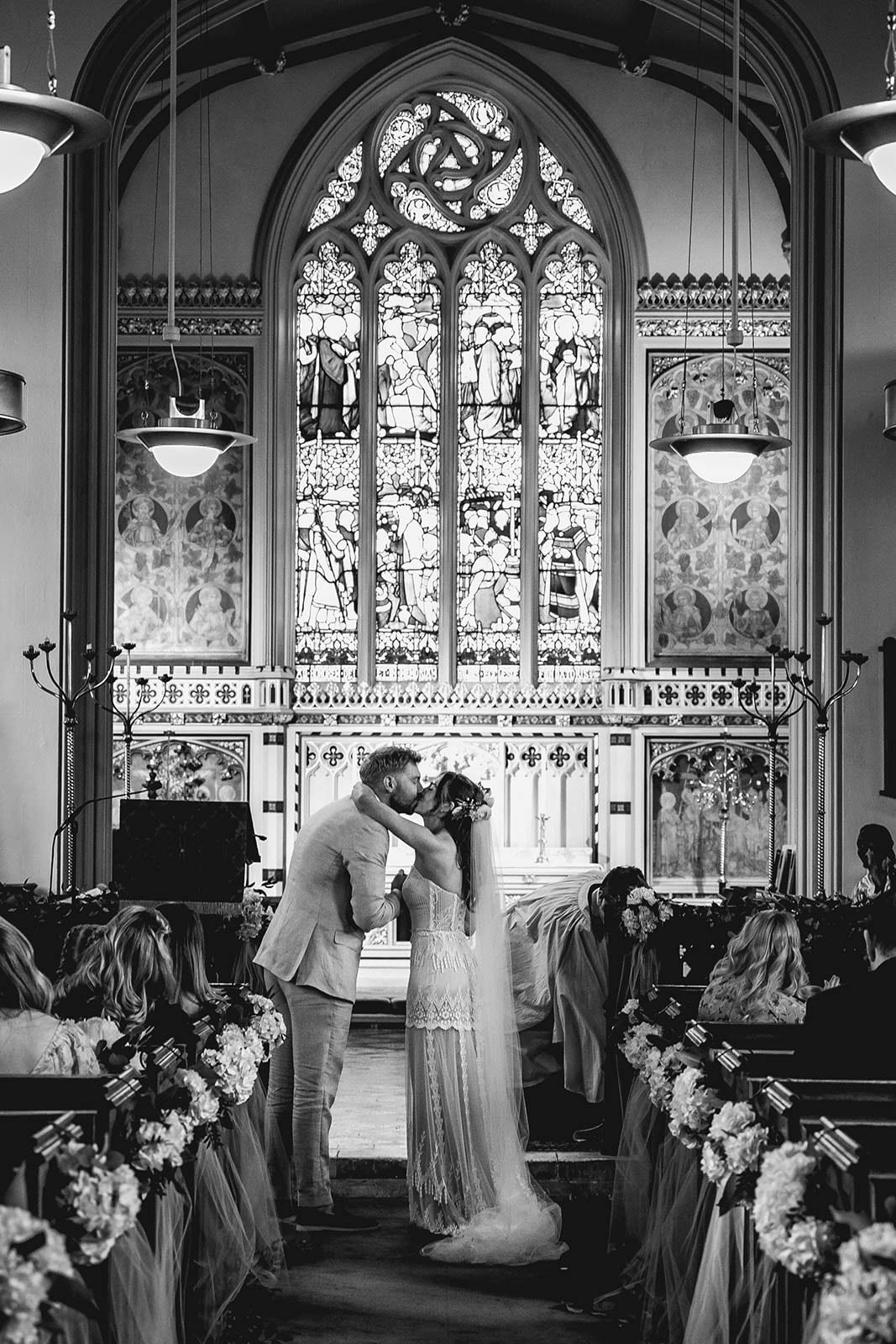 Bride and Groom kiss after wedding vows.