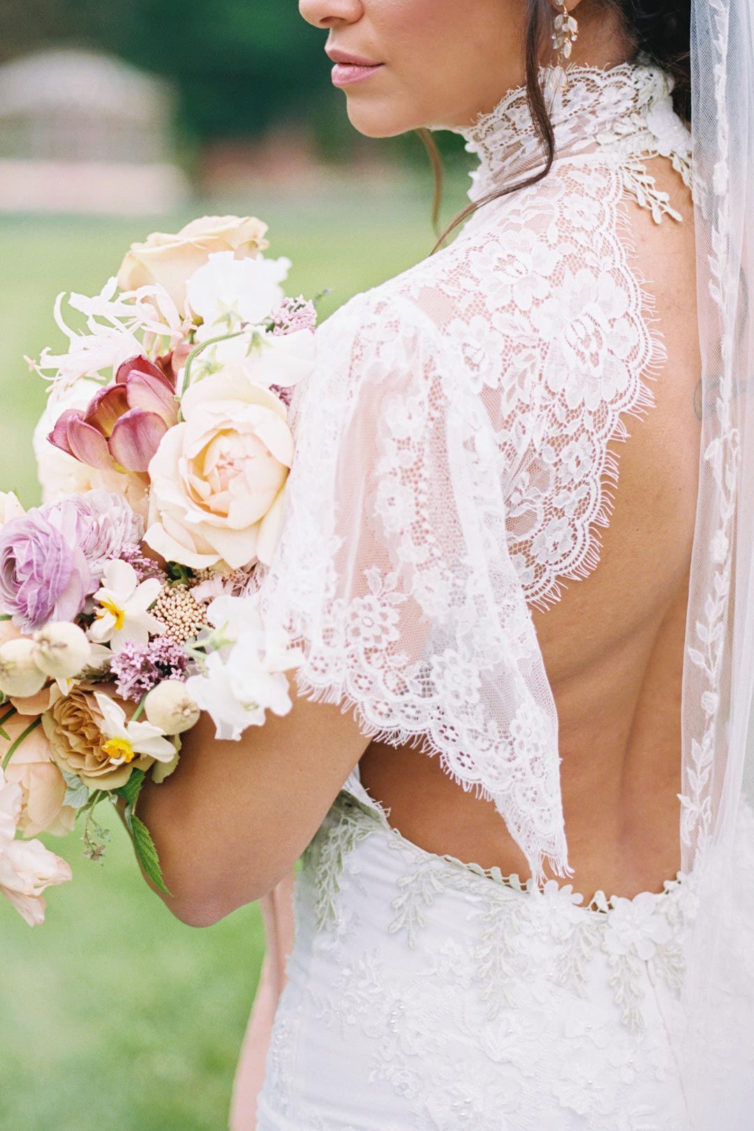 Bride in Grace Scoop Back Wedding Dress hold wedding floral bouquet