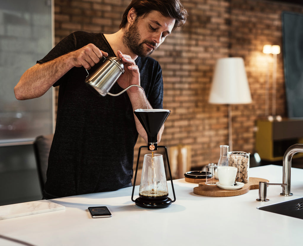 Barista preparing coffee on GINA smart coffee instrument