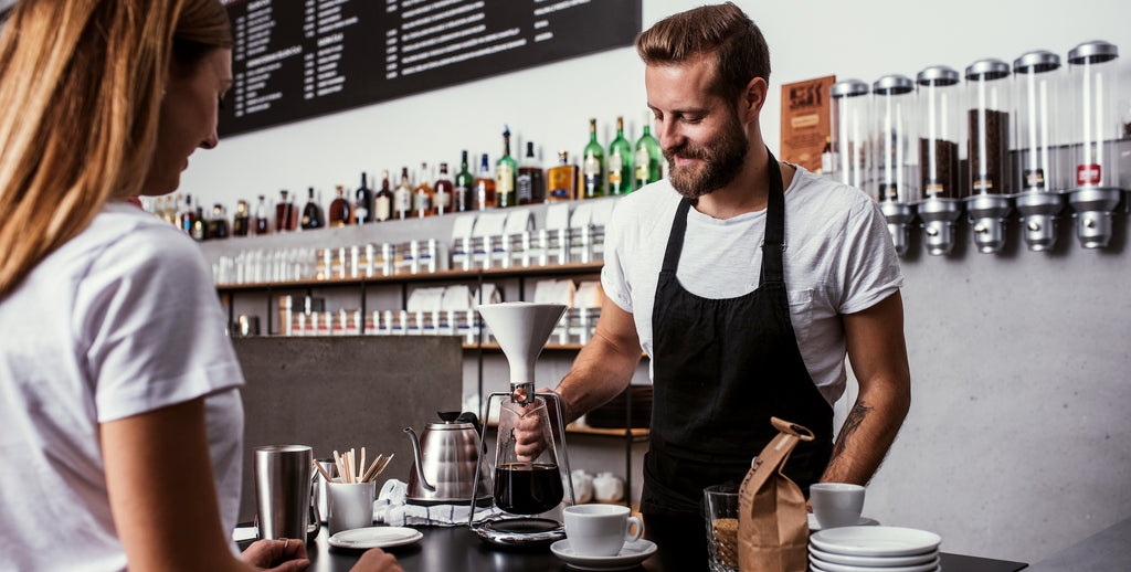 Barista preparing coffee with GINA