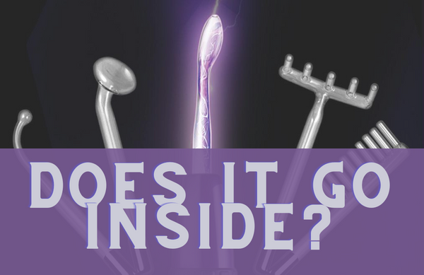 black background with violet wand attachments arranged in an arch, the violet wand with electricity pulsing through it in is in the middle. in the foreground the grey text on a purple ground reads "does it go inside"