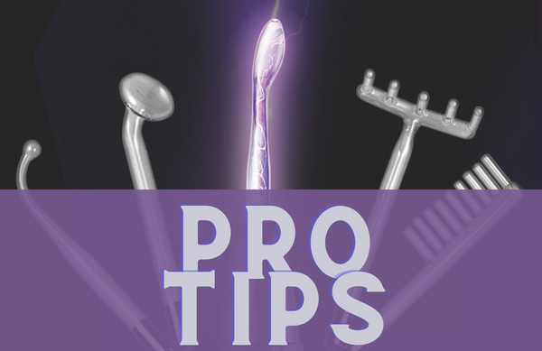 black background with violet wand attachments arranged in an arch, the violet wand with electricity pulsing through it in is in the middle. in the foreground the grey text on a purple ground reads "PRO TIPS"