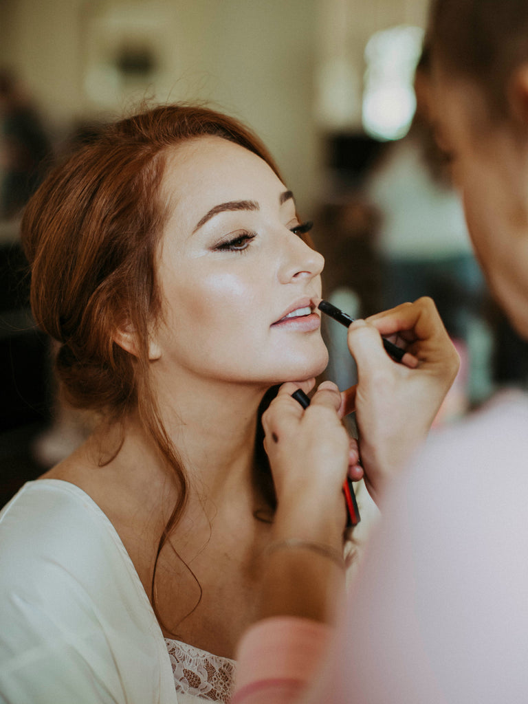 Brittany Mason Makeup Artist finishing Samantha Wynne Bride Ashleigh's Makeup