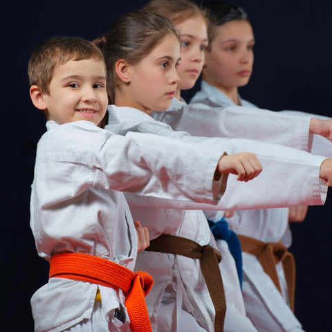 kids punching in karate class