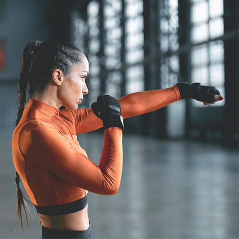 women boxing punching and training