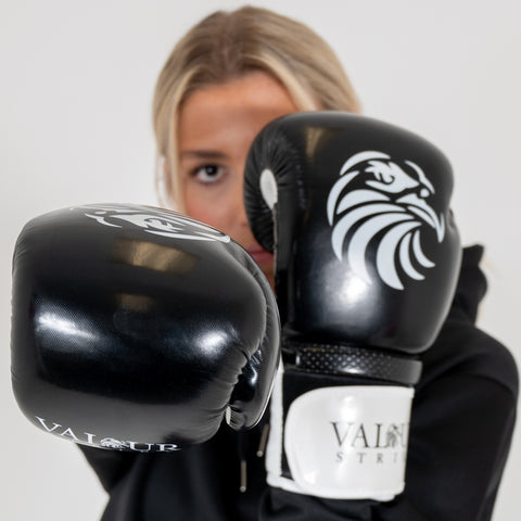woman black boxing gloves
