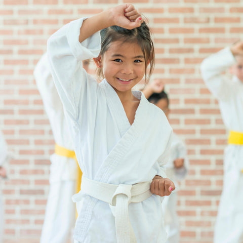 kid happy blocking punch martial arts training