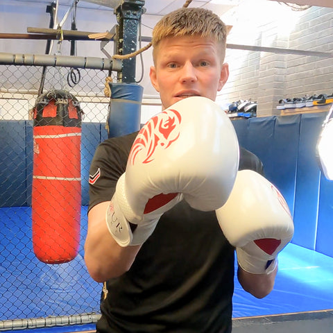 valour strike boxing gloves white on kickboxing champion rob zab